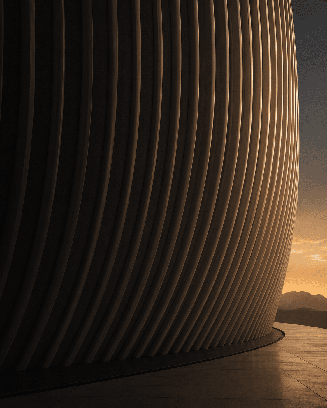 Ribbed architectural curve in warm light — Investment & Private Sector